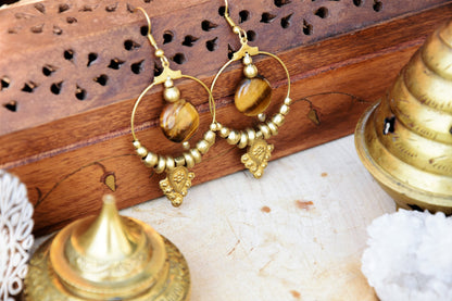 Golden brass Tiger eye earrings with tribal charm