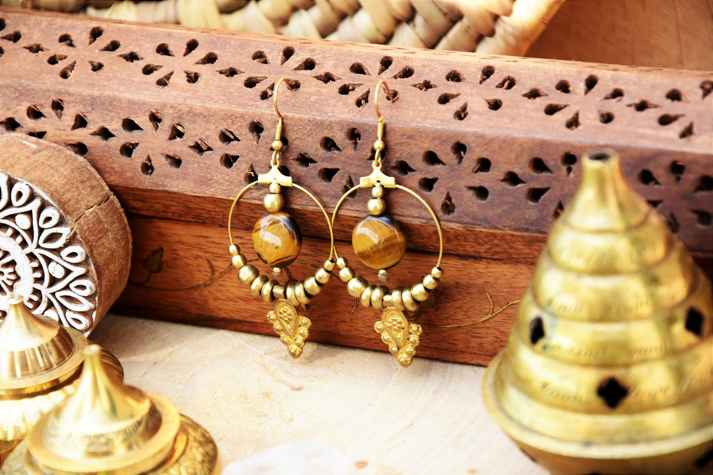 Golden brass Tiger eye earrings with tribal charm