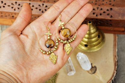 Golden brass Tiger eye earrings with tribal charm