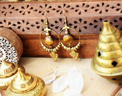 Golden brass Tiger eye earrings with tribal charm