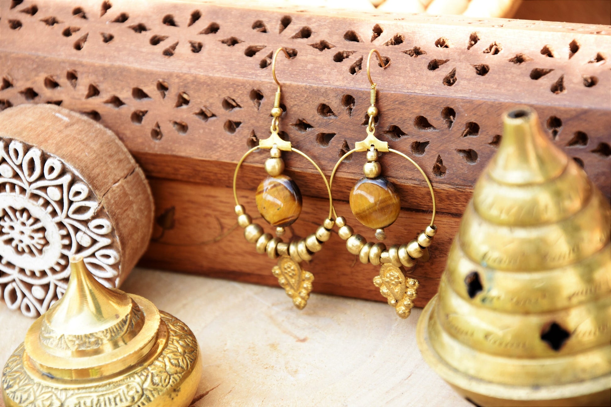 Golden brass Tiger eye earrings with tribal charm