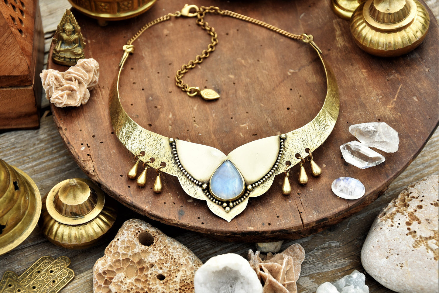 Golden torque necklace with a Moonstone crystal and tribal drop charms