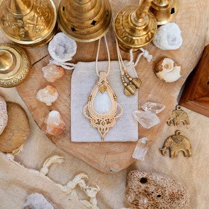 Bohemian macrame pendant with white quartz and brass charm