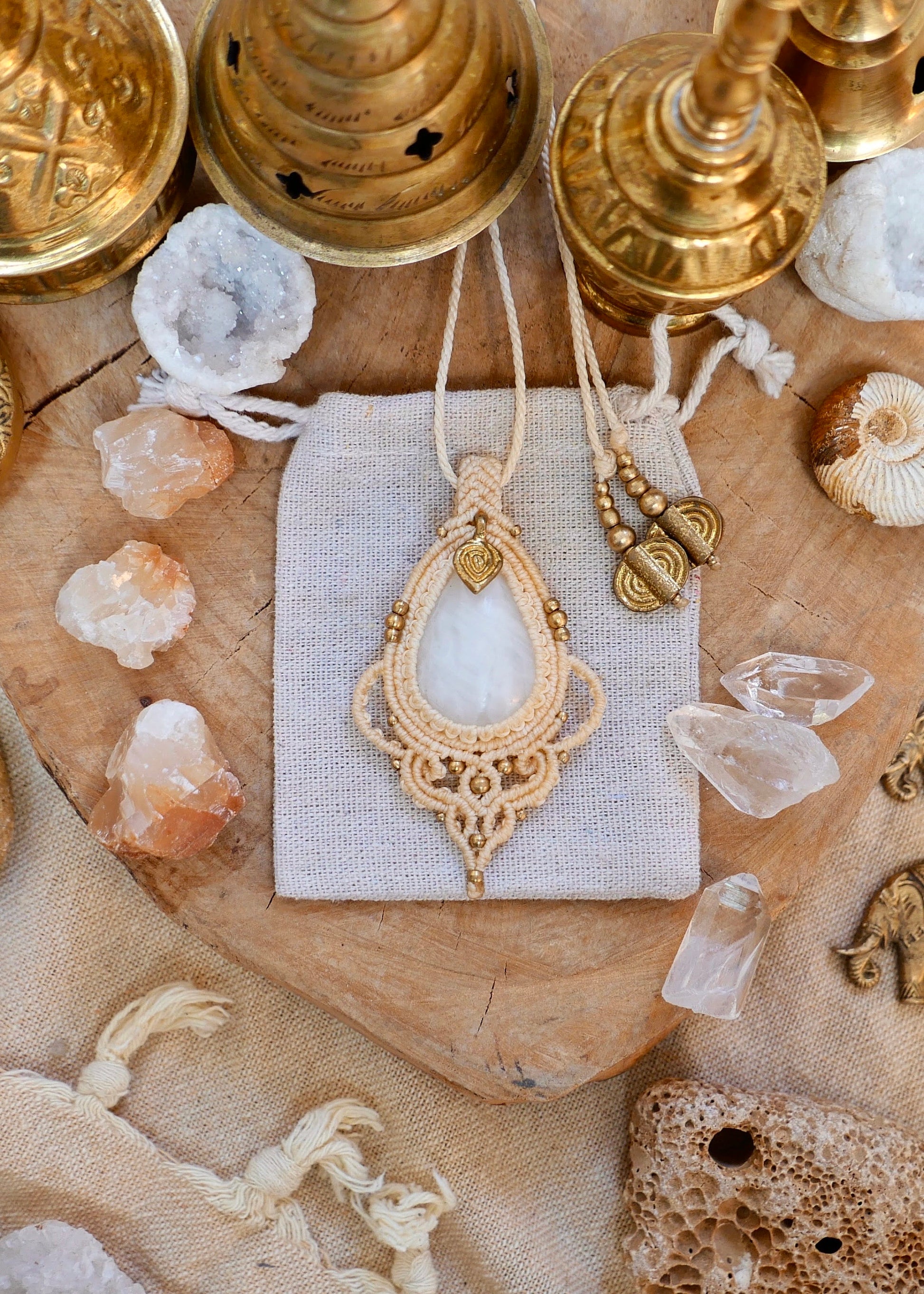 Bohemian macrame pendant with white quartz and brass charm