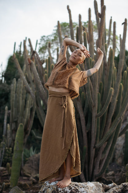 Bohemian high waist assymetric maxi wrap skirt made from cotton with fringed edges and a high low fit and flare design | Rust